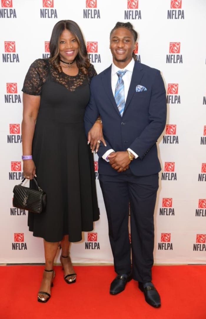 Isaiah Land and Mother at NFLPA Event