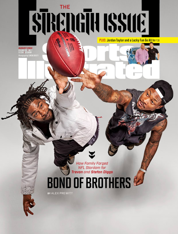 Trevon and Stefon Diggs leap for a football on the cover of the Sports Illustrated August 2022 issue