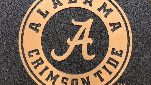 Alabama script A, gold with black background