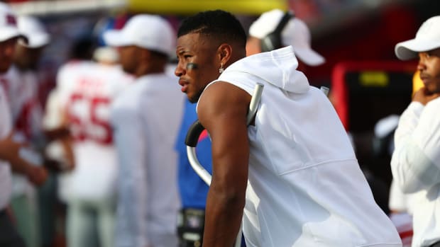 Sep 22, 2019; Tampa, FL, USA;New York Giants running back Saquon Barkley (26) stands on the sideline with crutches during the second half against the Tampa Bay Buccaneers at Raymond James Stadium.