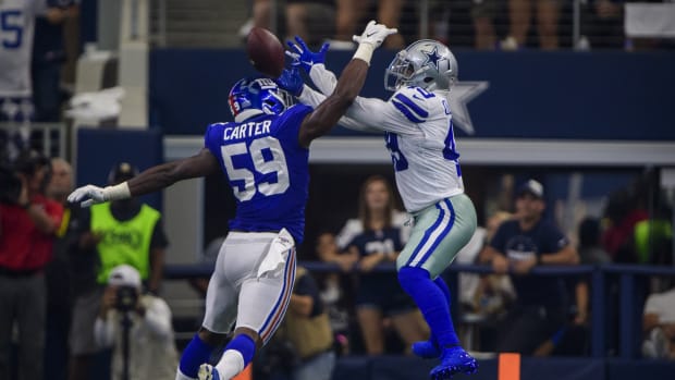 Sep 8, 2019; Arlington, TX, USA; New York Giants linebacker Lorenzo Carter (59) breaks up a pass intended for Dallas Cowboys running back Jamize Olawale (49) during the second quarter at AT&T Stadium.