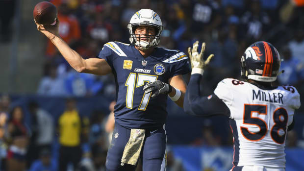 Los Angeles Chargers quarterback Philip Rivers (17) throws a pass in the first quarter past Denver Broncos outside linebacker Von Miller (58) at StubHub Center.