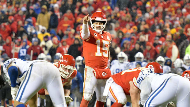 Jan 12, 2019; Kansas City, MO, USA; Kansas City Chiefs quarterback Patrick Mahomes (15) motions at the line of scrimmage against the Indianapolis Colts in an AFC Divisional playoff football game at Arrowhead Stadium.
