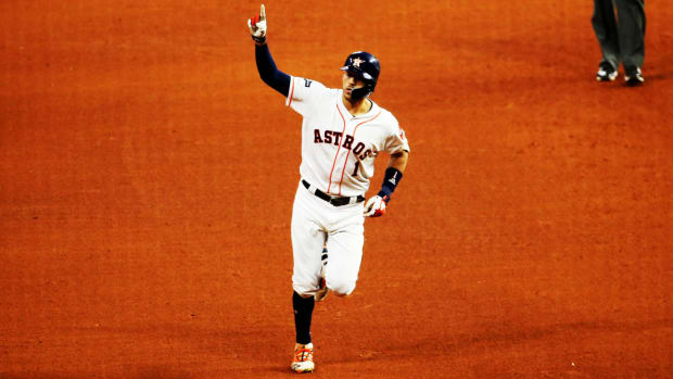 Oct 13, 2019; Houston, TX, USA; Houston Astros shortstop Carlos Correa (1) hits the game-winning solo home run in the 11th inning in game two of the 2019 ALCS playoff baseball series against the New York Yankees at Minute Maid Park. Mandatory Credit: Troy Taormina-USA TODAY Sports