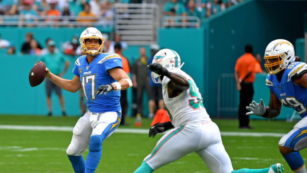 Sep 29, 2019; Miami Gardens, FL, USA; Los Angeles Chargers quarterback Philip Rivers (17) is pressured by Miami Dolphins defensive end Charles Harris (90) during the second half at Hard Rock Stadium. Mandatory Credit: Steve Mitchell-USA TODAY Sports