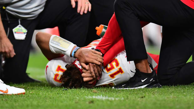 Injured Patrick Mahomes lays on the field