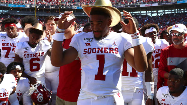 Oct 12, 2019; Dallas, TX, USA; Oklahoma Sooners quarterback Jalen Hurts (1) wears the Golden Hat trophy after a victory against the Texas Longhorns at Cotton Bowl. Mandatory Credit: Matthew Emmons-USA TODAY Sports