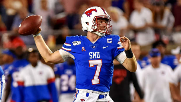Oct 5, 2019; Dallas, TX, USA; SMU Mustangs quarterback Shane Buechele (7) looks downfield during the second quarter against Tulsa Golden Hurricanes at Gerald J. Ford Stadium. Mandatory Credit: Timothy Flores-USA TODAY Sports