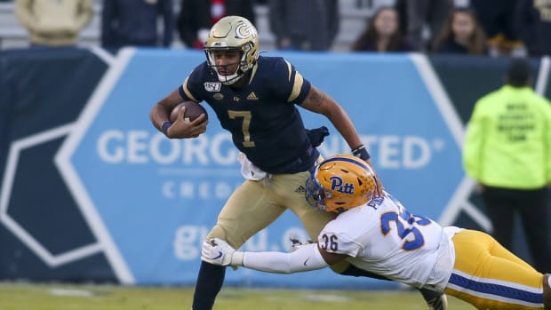 Georgia Tech Yellow Jackets quarterback Lucas Johnson (7) is tackled by Pittsburgh Panthers linebacker Chase Pine (36) in the third quarter at Bobby Dodd Stadium.