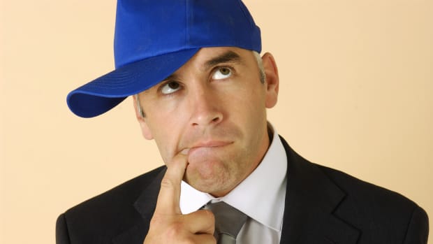 Confused guy in baseball hat (stock photo)