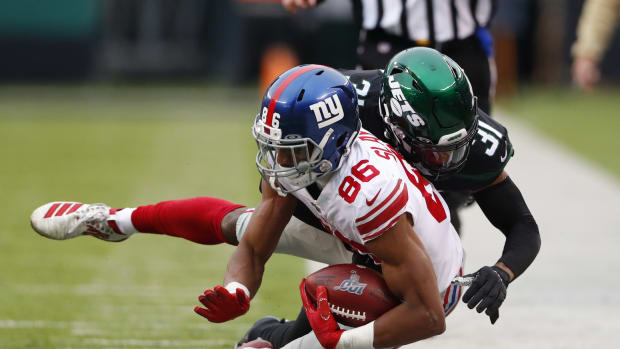 Nov 10, 2019; East Rutherford, NJ, USA; New York Giants wide receiver Darius Slayton (86) is tackled by New York Jets defensive back Blessuan Austin (31) during the second half at MetLife Stadium.
