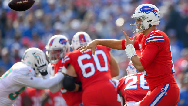 Buffalo Bills quarterback Josh Allen (17) passes the ball against the Miami Dolphins during the first quarter at New Era Field.