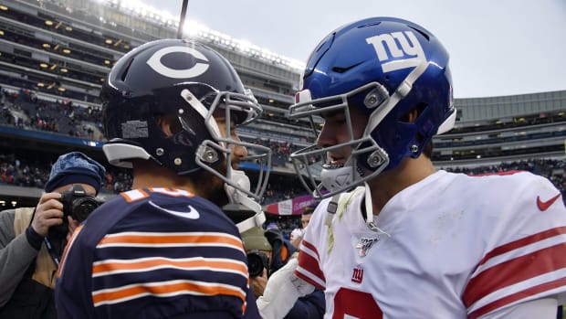 Nov 24, 2019; Chicago, IL, USA; New York Giants quarterback Eli Manning (10) shakes hands with New York Giants quarterback Daniel Jones (8) after the game at Soldier Field. Mandatory Credit: Quinn Harris-USA TODAY Sports