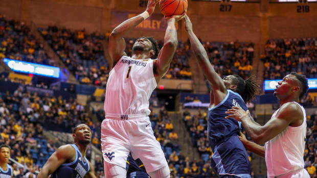 West Virginia Mountaineers forward Derek Culver (1) shoots in the lane during the second half against the Rhode Island Rams at WVU Coliseum.