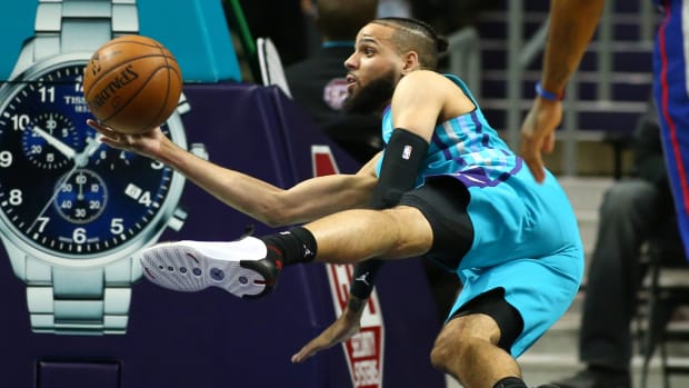 Nov 15, 2019; Charlotte, NC, USA; Charlotte Hornets forward Cody Martin (11) saves a ball from going out of bounds during the second half against the Detroit Pistons at Spectrum Center. Mandatory Credit: Jeremy Brevard-USA TODAY Sports
