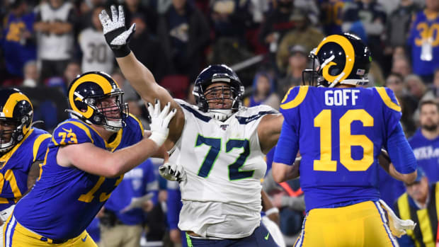 Seattle Seahawks defensive tackle Al Woods (72) pressures Los Angeles Rams quarterback Jared Goff (16) during the third quarter at Los Angeles Memorial Coliseum. Block on the play is Los Angeles Rams offensive guard David Edwards (73).