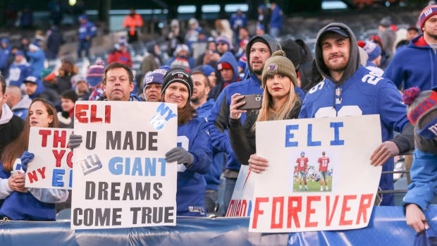 Dec 15, 2019; East Rutherford, NJ, USA; New York Giants fans hold signs honoring New York Giants quarterback Eli Manning, not picture, after the game between the New York Giants and the Miami Dolphins at MetLife Stadium.