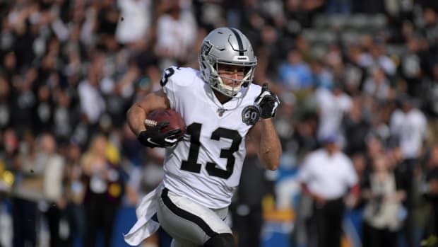 Oakland Raiders wide receiver Hunter Renfrow (13) scores on a 56-yard touchdown reception in the first quarter against the Los Angeles Chargers at Dignity Health Sports Park.