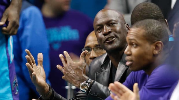 Dec 23, 2016; Charlotte, NC, USA; Charlotte Hornets owner Michael Jordan yells at an official in the second half against the Chicago Bulls at Spectrum Center. The Hornets defeated the Bulls 103-91. Mandatory Credit: Jeremy Brevard-USA TODAY Sports