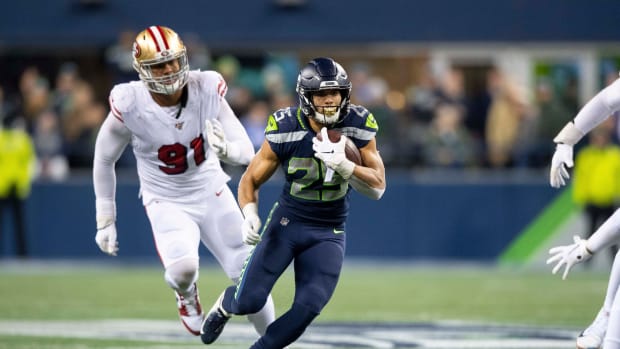 Seattle Seahawks running back Travis Homer (25) carries the ball against the San Francisco 49ers during the second half at CenturyLink Field. San Francisco defeated Seattle 26-21.