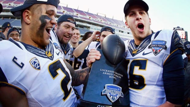 Jared Goff, right, and teammates celebrate the Armed Force Bowl victory.