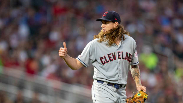 Aug 8, 2019; Minneapolis, MN, USA; Cleveland Indians starting pitcher Mike Clevinger (52) gives the thumbs up signal after getting hit by a ground ball in the fourth inning against the Minnesota Twins at Target Field.