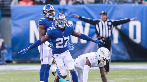 Dec 15, 2019; East Rutherford, NJ, USA; New York Giants cornerback Deandre Baker (27) reacts after breaking up a pass intended for Miami Dolphins wide receiver DeVante Parker (11) during the first half at MetLife Stadium.