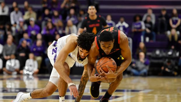 Northwestern Wildcats guard Boo Buie (left) and Maryland Terrapins guard Serrel Smith Jr. (right) battle for the basketball in the first half at Welsh-Ryan Arena.