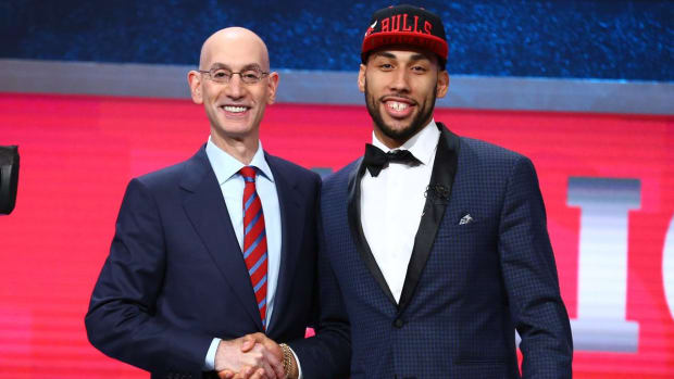 Denzel Valentine poses with the commissioner of the NBA after being selected 14th by the Chicago Bulls.  Photo courtesy of the Bulls.