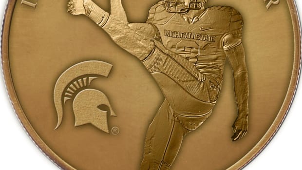 Mike Sadler B1G coin photo courtesy of the Big Ten Conference.