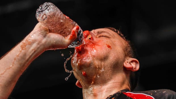 Joey Chestnut drinks water during a shrimp cocktail-eating contest