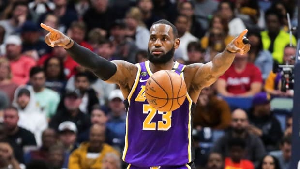 Los Angeles Lakers forward LeBron James points during a game against the New Orleans Pelicans at the Smoothie King Center.