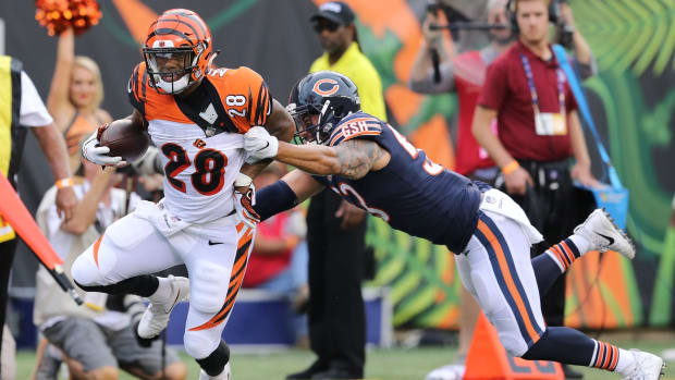 Cincinnati Bengals running back Joe Mixon (28) breaks free from Chicago Bears linebacker John Timu (53) on a touchdown and run in the first quarter in the Week 1 preseason game of the NFL between the Chicago Bears and the Cincinnati Bengals on Thursday, August 1.  January 9, 2018 at Paul Brown Stadium in Cincinnati.  080918_BENGALS KE, Chicago Bears at Cincinnati Bengals Week 1 preseason game