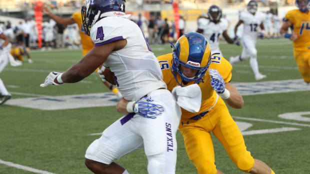 Angelo State University's Grant Emmons, a former Menard High School standout, tries to bring down Tarleton State wide receiver Zimari Manning during a Lone Star Conference football game at LeGrand Stadium at 1st Community Credit Union Field on Saturday, Sept. 29, 2018. Asu Vs Tsu 4