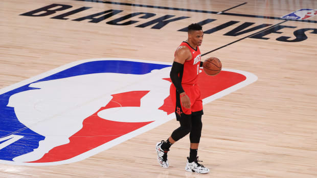 July 31, 2020; Lake Buena Vista, USA; Russell Westbrook #0 of the Houston Rockets dribbles during the first half against the Dallas Mavericks at The Arena at ESPN Wide World Of Sports Complex on July 31, 2020 in Lake Buena Vista, Florida.