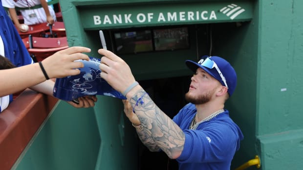 Jul 14, 2019; Boston, MA, USA; Los Angeles Dodgers out fielder Alex Verdugo (27) signs an autograph prior to a game against the Boston Red Sox at Fenway Park. Mandatory Credit: Bob DeChiara-USA TODAY Sports