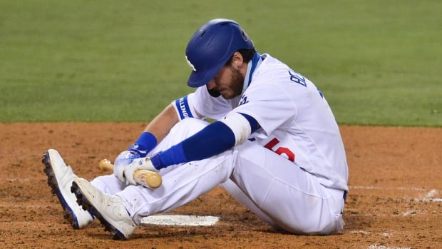 August 11, 2020; Los Angeles, California, USA; Los Angeles Dodgers center fielder Cody Bellinger (35) reacts after almost being hit by pitch against the San Diego Padres during the sixth inning at Dodger Stadium. Mandatory Credit: Gary A. Vasquez-USA TODAY Sports