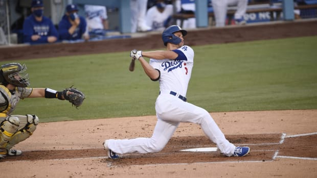 Aug 13, 2020; Los Angeles, California, USA; Los Angeles Dodgers shortstop Corey Seager (5) follows through on a swing for a two-run home run during the first inning against the San Diego Padres at Dodger Stadium. Mandatory Credit: Kelvin Kuo-USA TODAY Sports