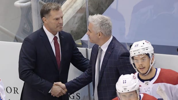 Montreal Canadiens assistant coach Kirk Muller, left took the spot after head coach Claude Julien is out due to health issues for their game against the Philadelphia Flyers in game two of the first round of the NHL playoffs.