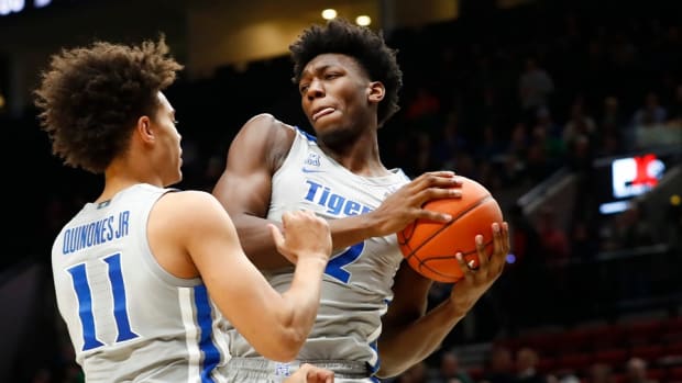 Memphis Tigers center James Wiseman grabs a rebound next to teammate Lester Quinones during their game against the Oregon Ducks at the Moda Center in Portland.