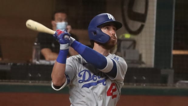 Aug 29, 2020; Arlington, Texas, USA; Los Angeles Dodgers center fielder Cody Bellinger hits a two run home run during the third inning against the Texas Rangers at Globe Life Field. Mandatory Credit: Kevin Jairaj-USA TODAY Sports
