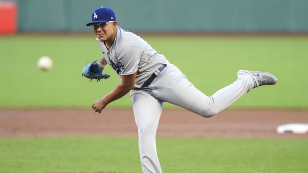 August 25, 2020; San Francisco, California, USA; Los Angeles Dodgers starting pitcher Julio Urias (7) delivers a pitch against the San Francisco Giants during the first inning at Oracle Park. Mandatory Credit: Kyle Terada-USA TODAY Sports