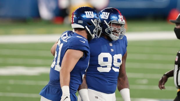Sep 14, 2020; East Rutherford, New Jersey, USA; New York Giants defensive end Leonard Williams (99) celebrates a sack with offensive tackle Tyler Haycraft (61) against the Pittsburgh Steelers during the second half at MetLife Stadium.
