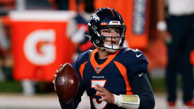 Denver Broncos quarterback Drew Lock (3) looks to pass in the fourth quarter against the Tennessee Titans at Empower Field at Mile High.