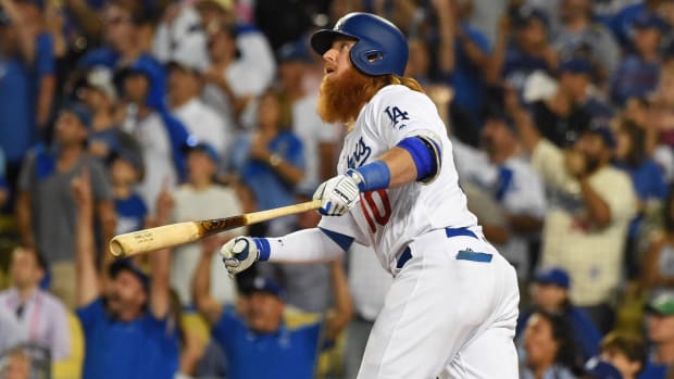 Oct 15, 2017; Los Angeles, CA, USA; Los Angeles Dodgers third baseman Justin Turner (10) hits a walk off home run in the ninth inning to defeat the Chicago Cubs in game two of the 2017 NLCS playoff baseball series at Dodger Stadium. Mandatory Credit: Jayne Kamin-Oncea-USA TODAY Sports