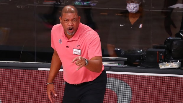 Former Los Angeles Clippers coach Doc Rivers reacts in the second half against the Denver Nuggets during the 2020 NBA Playoffs at AdventHealth Arena.
