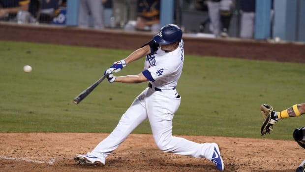Sep 30, 2020; Los Angeles, California, USA; Los Angeles Dodgers shortstop Corey Seager (5) follows through on a solo home run in the seventh inning against the Milwaukee Brewers during Game 1 of the National League Wild Card Playoffs at Dodger Stadium. Mandatory Credit: Kirby Lee-USA TODAY Sports
