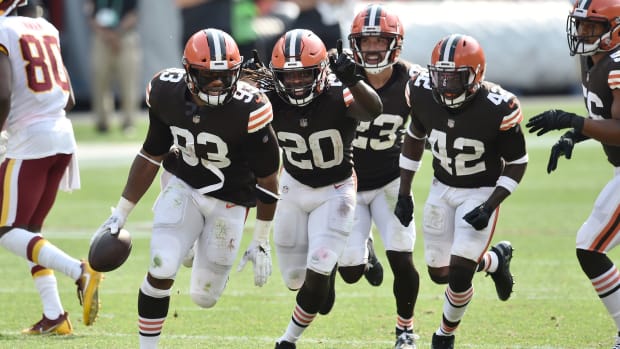 Sep 27, 2020; Cleveland, Ohio, USA; Cleveland Browns middle linebacker B.J. Goodson (93) and cornerback Tavierre Thomas (20) and free safety Andrew Sendejo (23) and strong safety Karl Joseph (42) celebrate after Goodson intercepted a pass during the second half against the Washington Football Team at FirstEnergy Stadium. Mandatory Credit: Ken Blaze-USA TODAY Sports