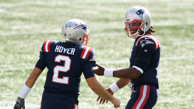 Sep 13, 2020; Foxborough, Massachusetts, USA; New England Patriots quarterback Cam Newton (1) talks with quarterback Brian Hoyer (2) during a timeout in the second half of a game against the Miami Dolphins at Gillette Stadium. Mandatory Credit: Brian Fluharty-USA TODAY Sports