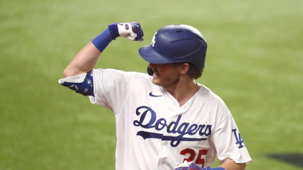 Oct 7, 2020; Arlington, Texas, USA; Los Angeles Dodgers center fielder Cody Bellinger (35) celebrates after hitting a solo home run off of San Diego Padres starting pitcher Zach Davies (not pictured) during the fourth inning in game two of the 2020 NLDS at Globe Life Field. Mandatory Credit: Kevin Jairaj-USA TODAY Sports